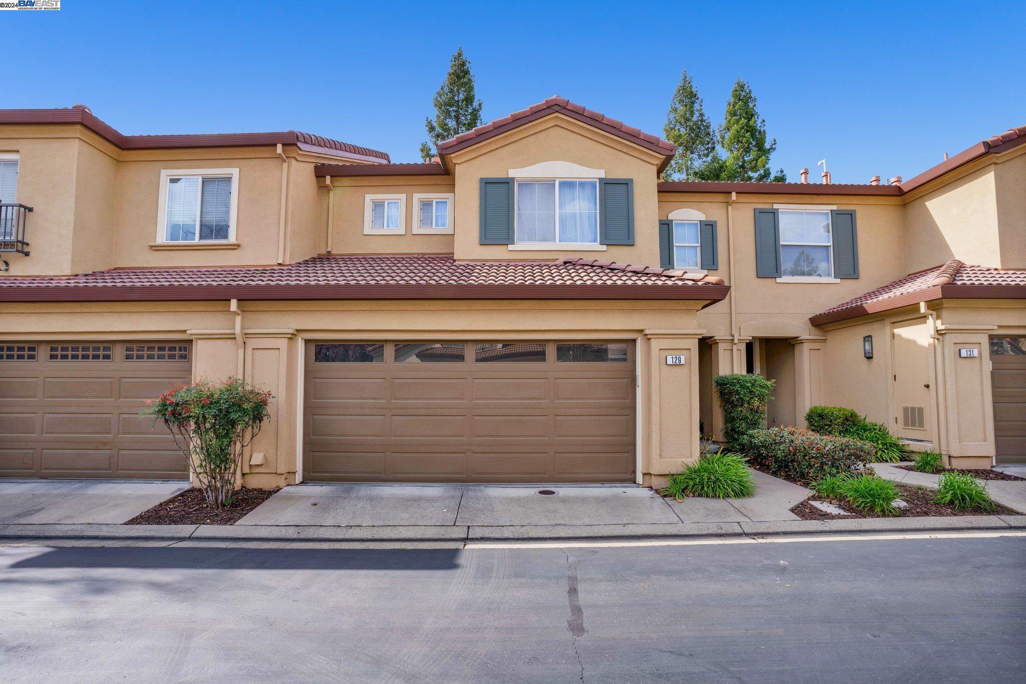 129 Coralflower Lane San Ramon, CA 94582 - Photo 1 of 1 a front view of a house with a yard and garage