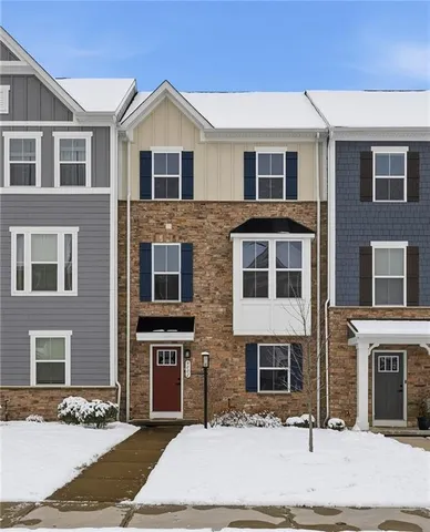 a front view of a house with yard