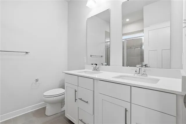 a bathroom with a glass shower door