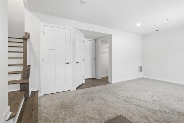 a view of an empty room with windows