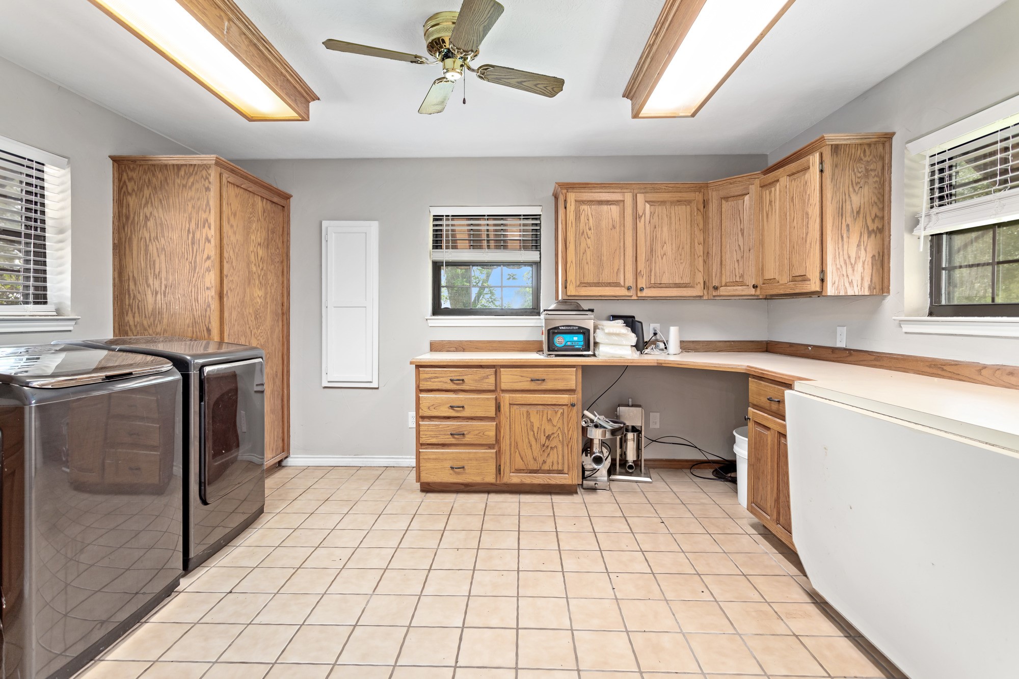 1747 Farm To Market Road 365 Nome, TX 77629 - Photo 15 of 24 a utility room with cabinets dryer and washer