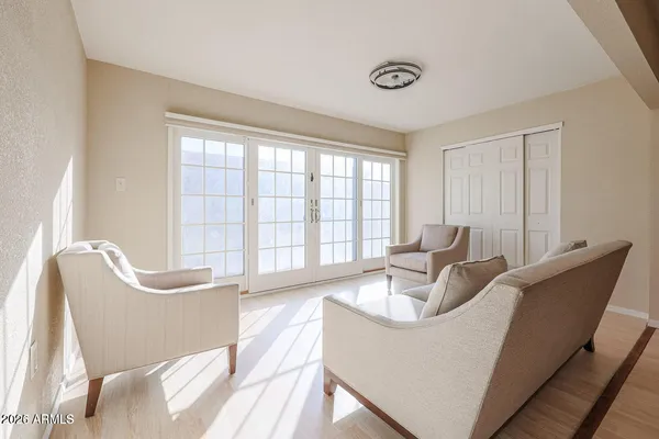 a living room with furniture and a large window