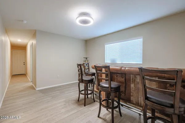 a view of a dining room with furniture and window
