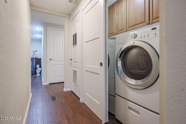 a view of a storage and utility room with washer and dryer
