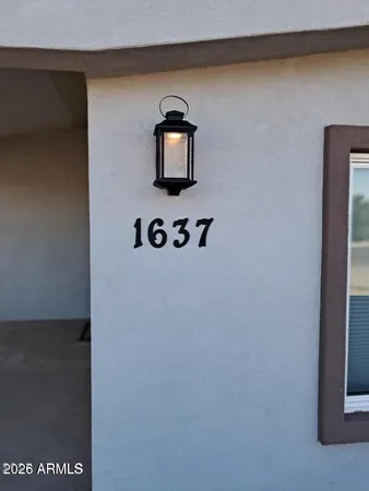 a bathroom with a toilet and mirror