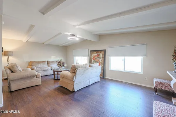a living room with furniture and a window
