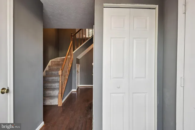 a view of entryway with stairs and wooden floor