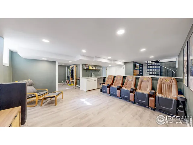 a living room with lots of furniture and white walls