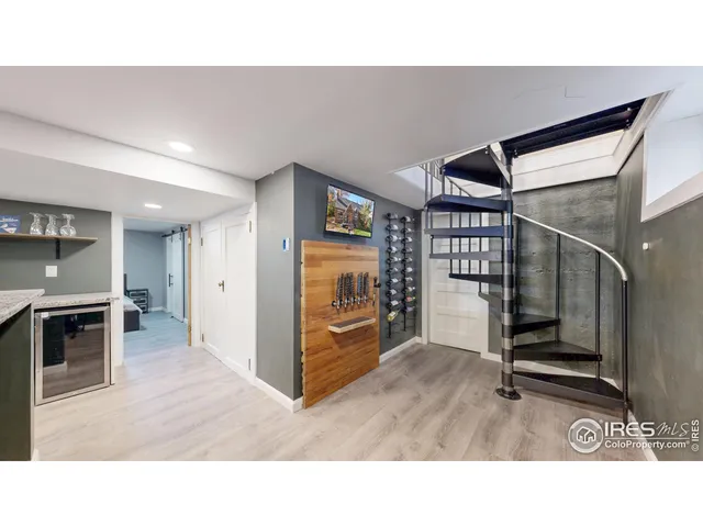 a room with lots of wooden furniture and a fireplace