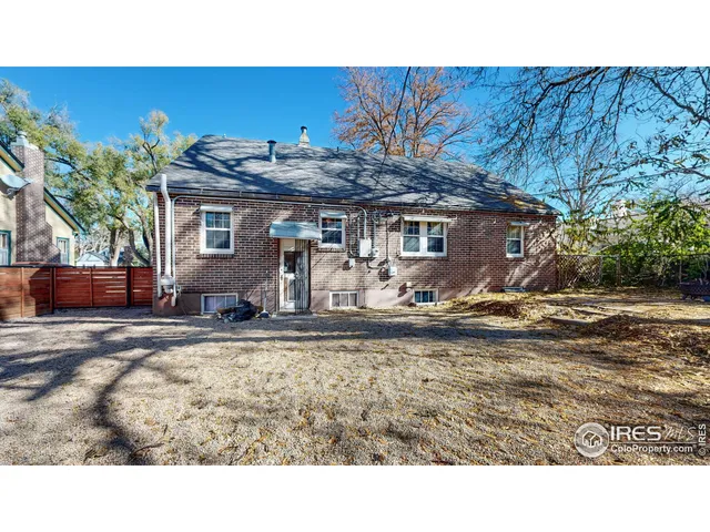 a view of a backyard with a sitting area