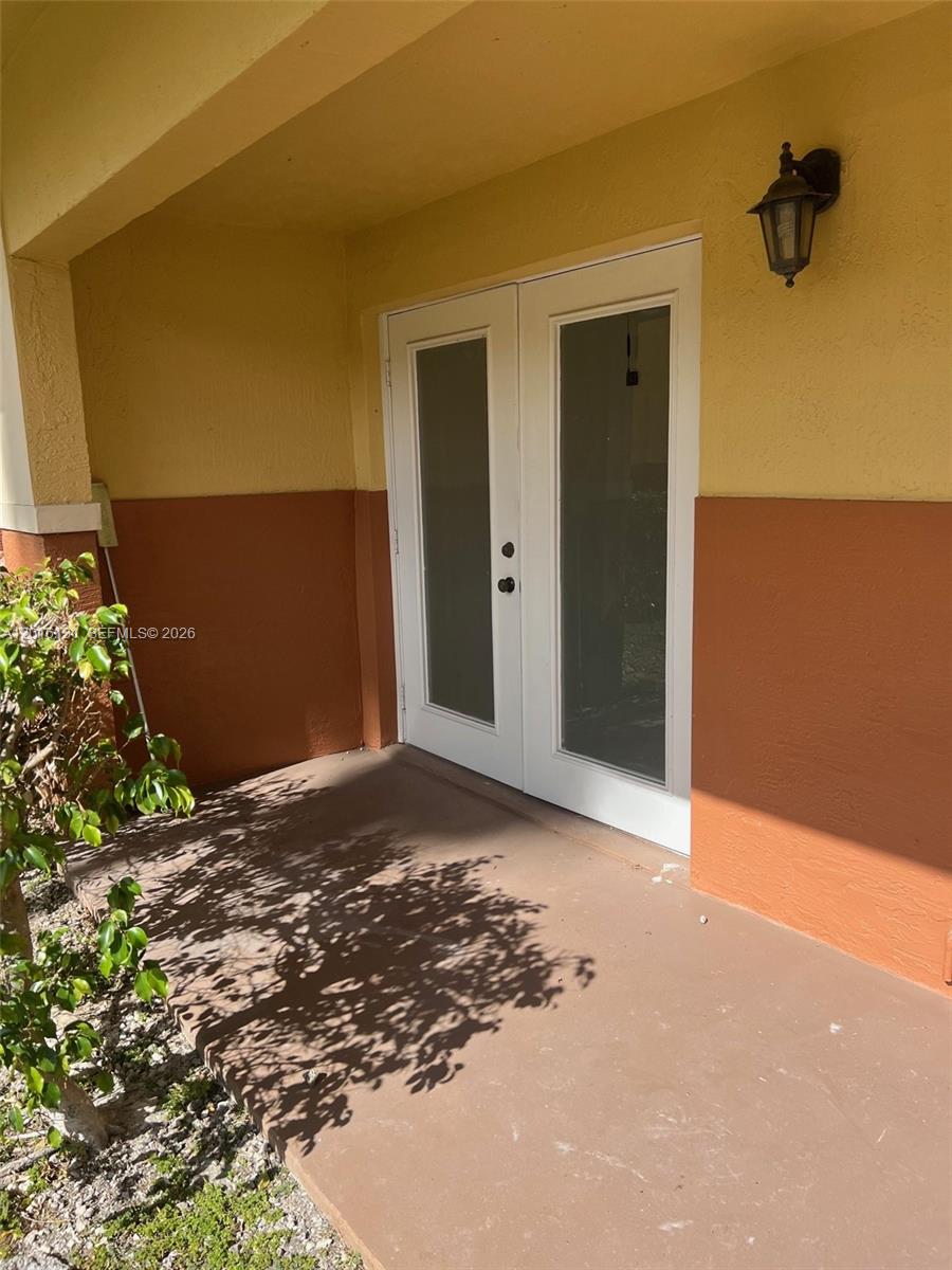 12605 Southwest 91st Street, Unit 103 Miami, FL 33186 - Photo 2 of 14 a view of a backyard of a house