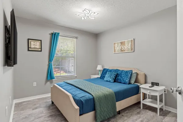 a view of a house with backyard porch and sitting area