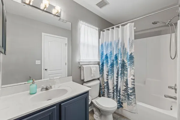 an aerial view of a house with a garden