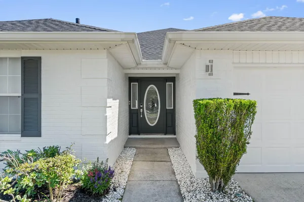 a large kitchen with a table and chairs
