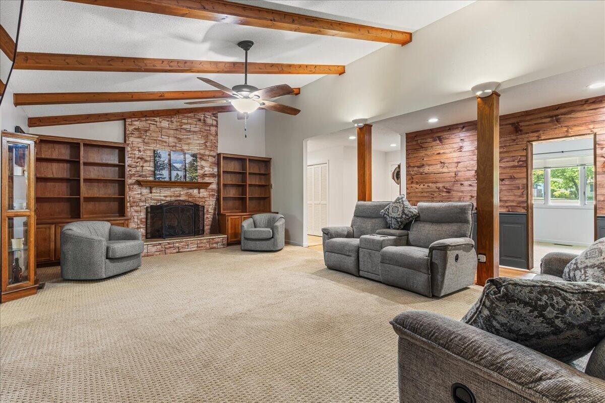 2522 Cindy Street Athens, TN 37303 - Photo 7 of 36 a living room with furniture a fireplace and a chandelier