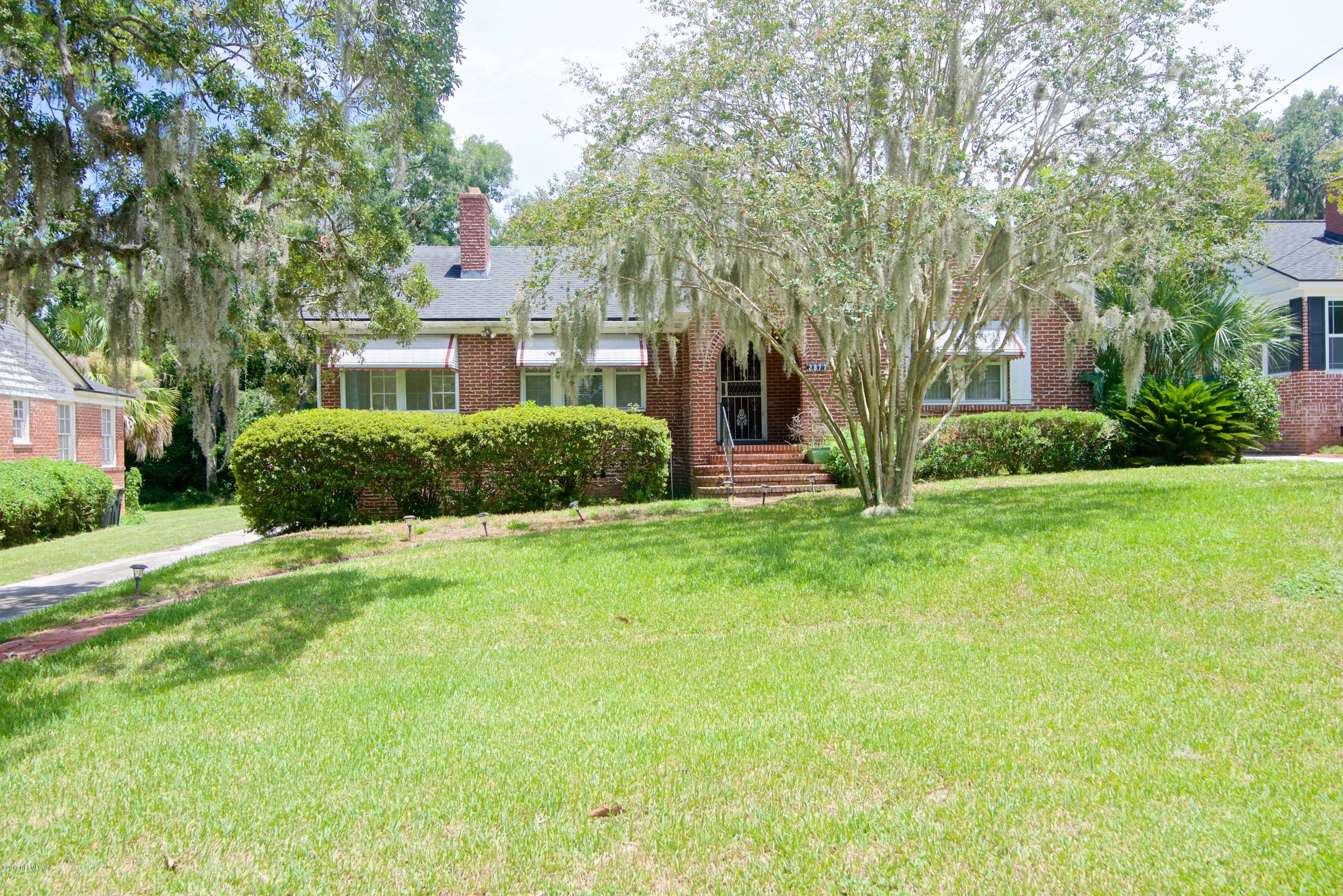 3877 Gadsden Road Jacksonville, FL 32207 - Photo 2 of 24 a front view of a house with garden