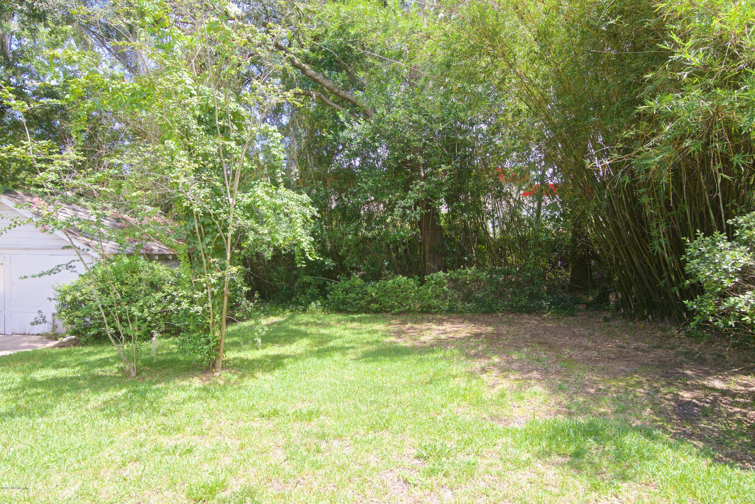 3877 Gadsden Road Jacksonville, FL 32207 - Photo 22 of 24 a view of outdoor space with deck and yard