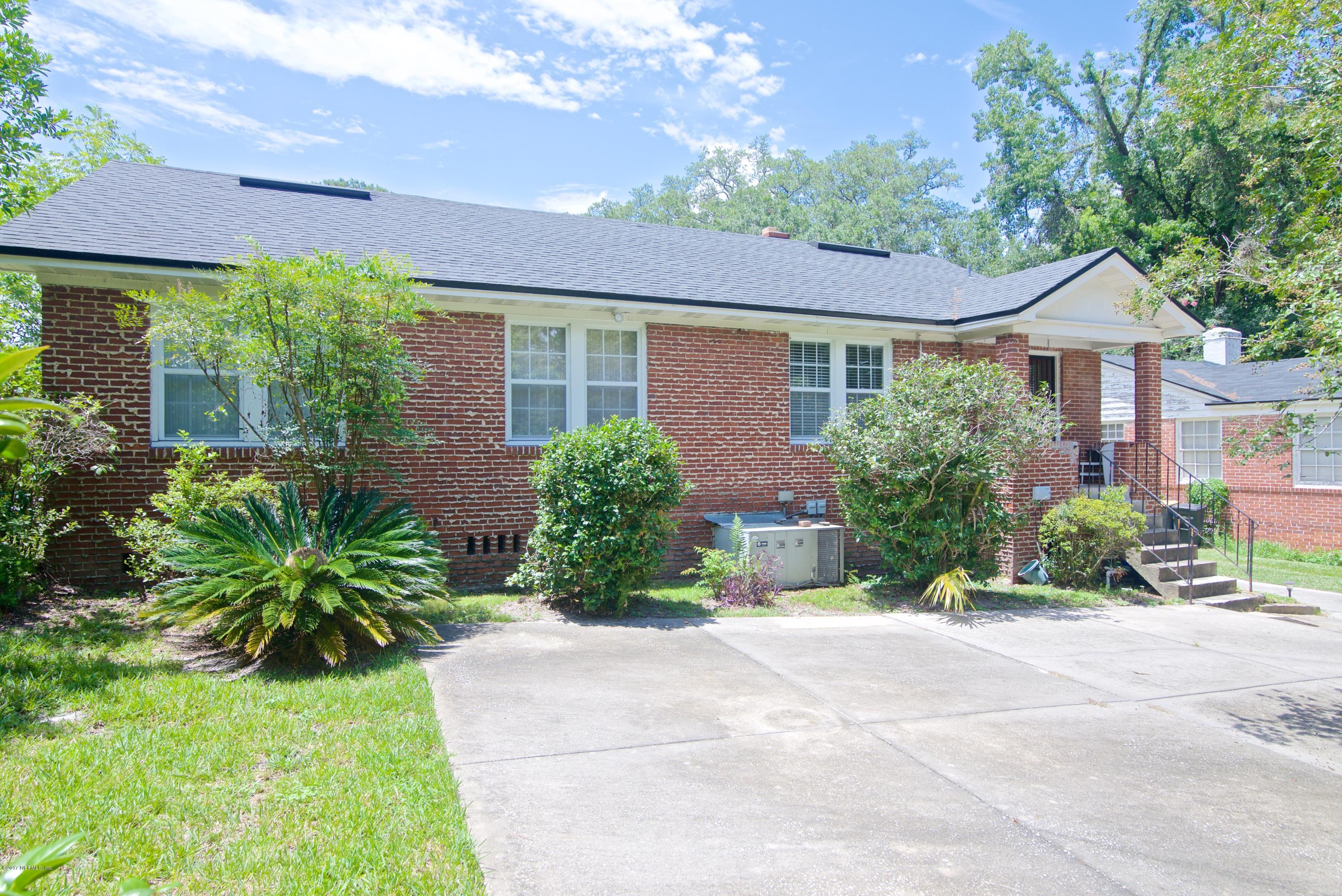 3877 Gadsden Road Jacksonville, FL 32207 - Photo 23 of 24 a front view of a house with a yard