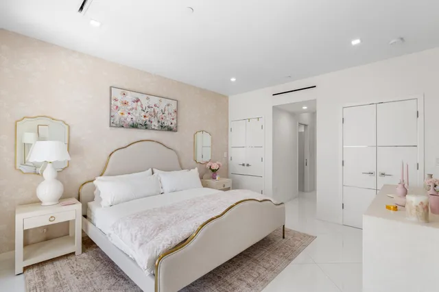 a bedroom with a bed and a couch