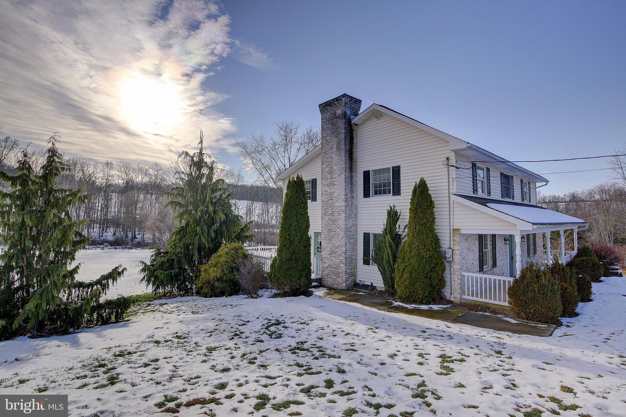 241 Earth Station Road Catawissa, PA 17820 - Photo 3 of 18 a front view of a house with garden