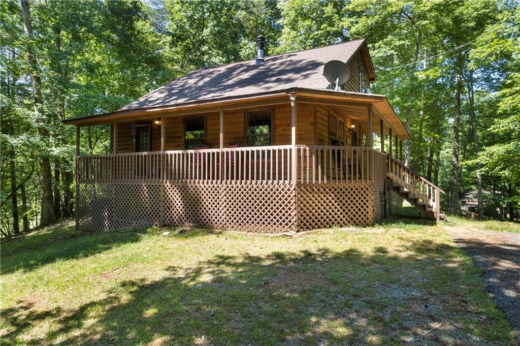 33 Mortis Court Ellijay, GA 30540 - Photo 1 of 1 a front view of a house with a yard