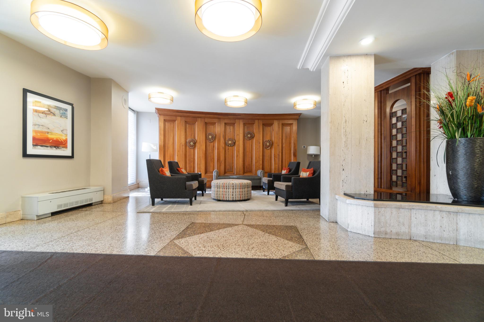 1111 University Boulevard West, Unit 813A Silver Spring, MD 20902 - Photo 14 of 22 a living room with furniture and a large window
