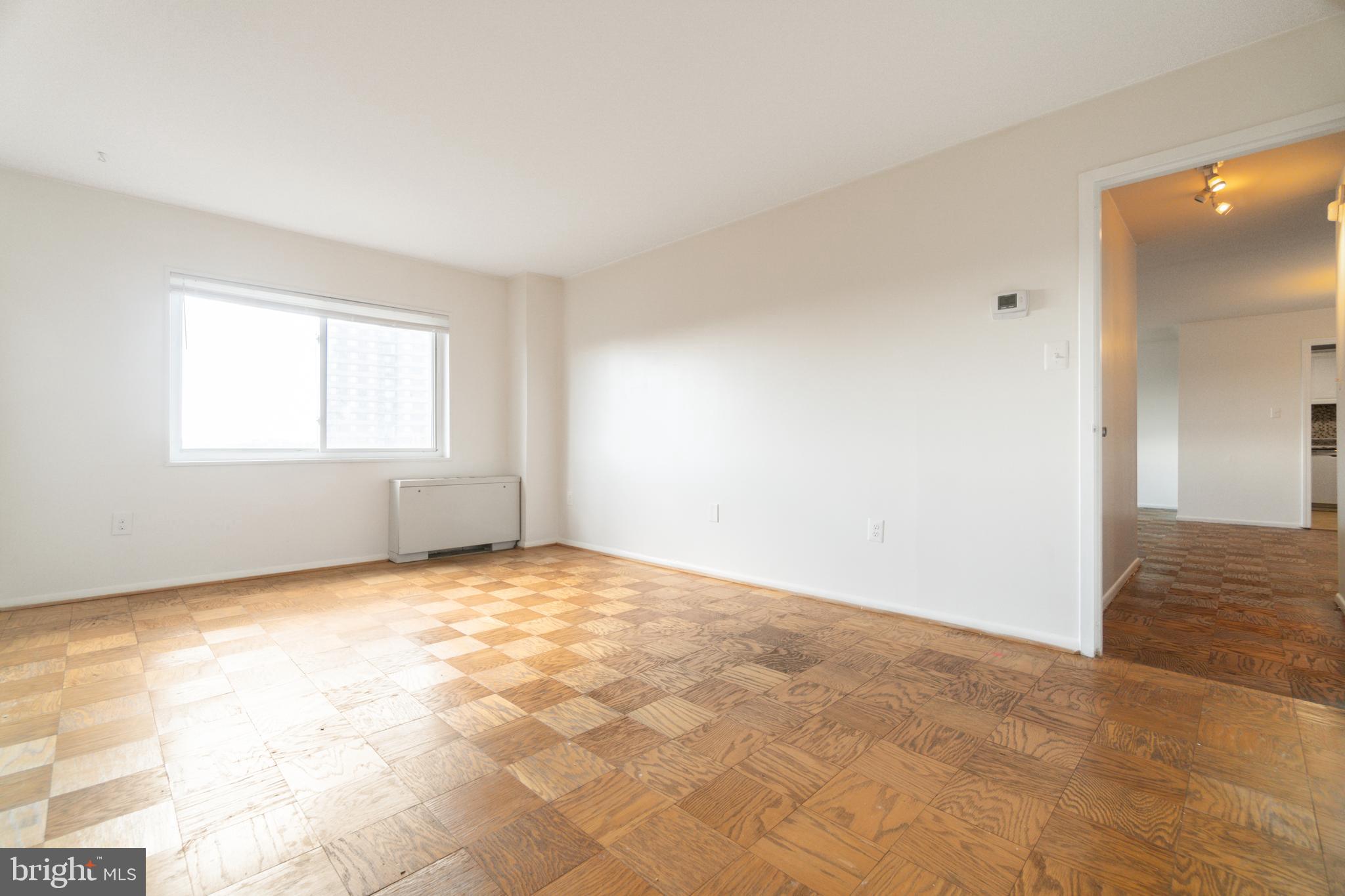 1111 University Boulevard West, Unit 813A Silver Spring, MD 20902 - Photo 4 of 22 a view of an empty room and window