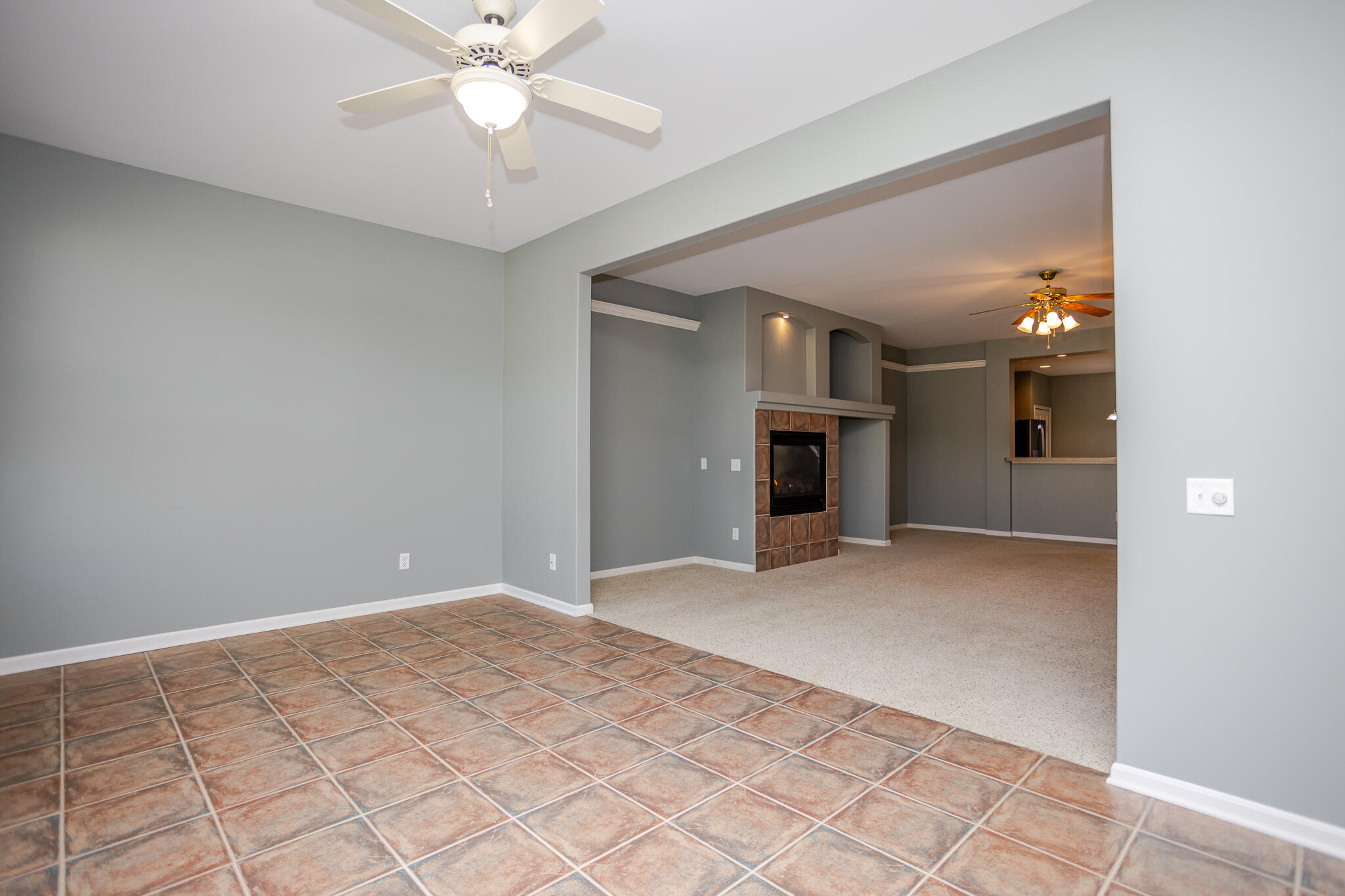 350 Cochran Drive Crown Point, IN 46307 - Photo 16 of 37 a view of a livingroom with a ceiling fan and window