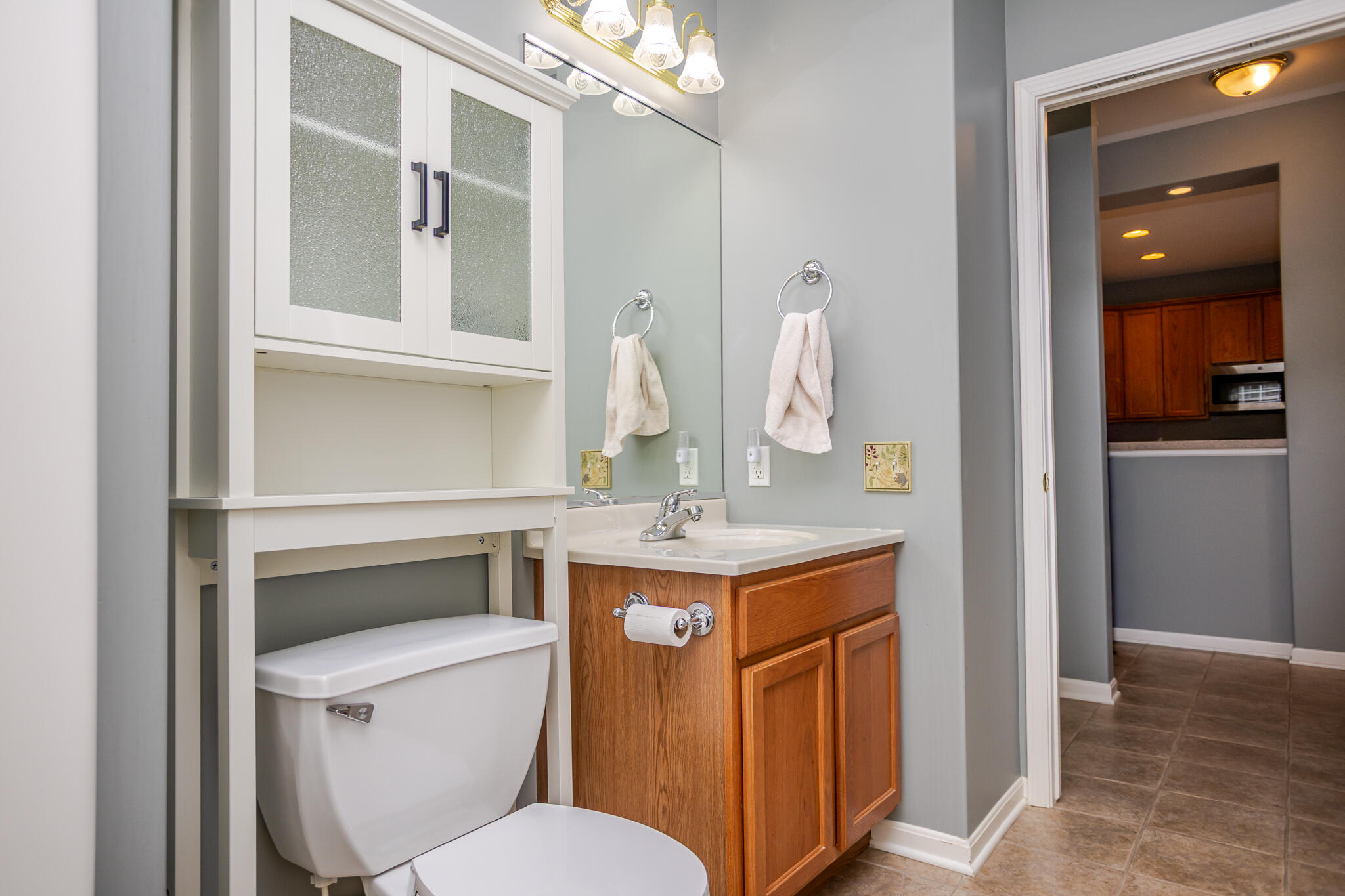 350 Cochran Drive Crown Point, IN 46307 - Photo 34 of 37 a bathroom with a granite countertop toilet sink and mirror