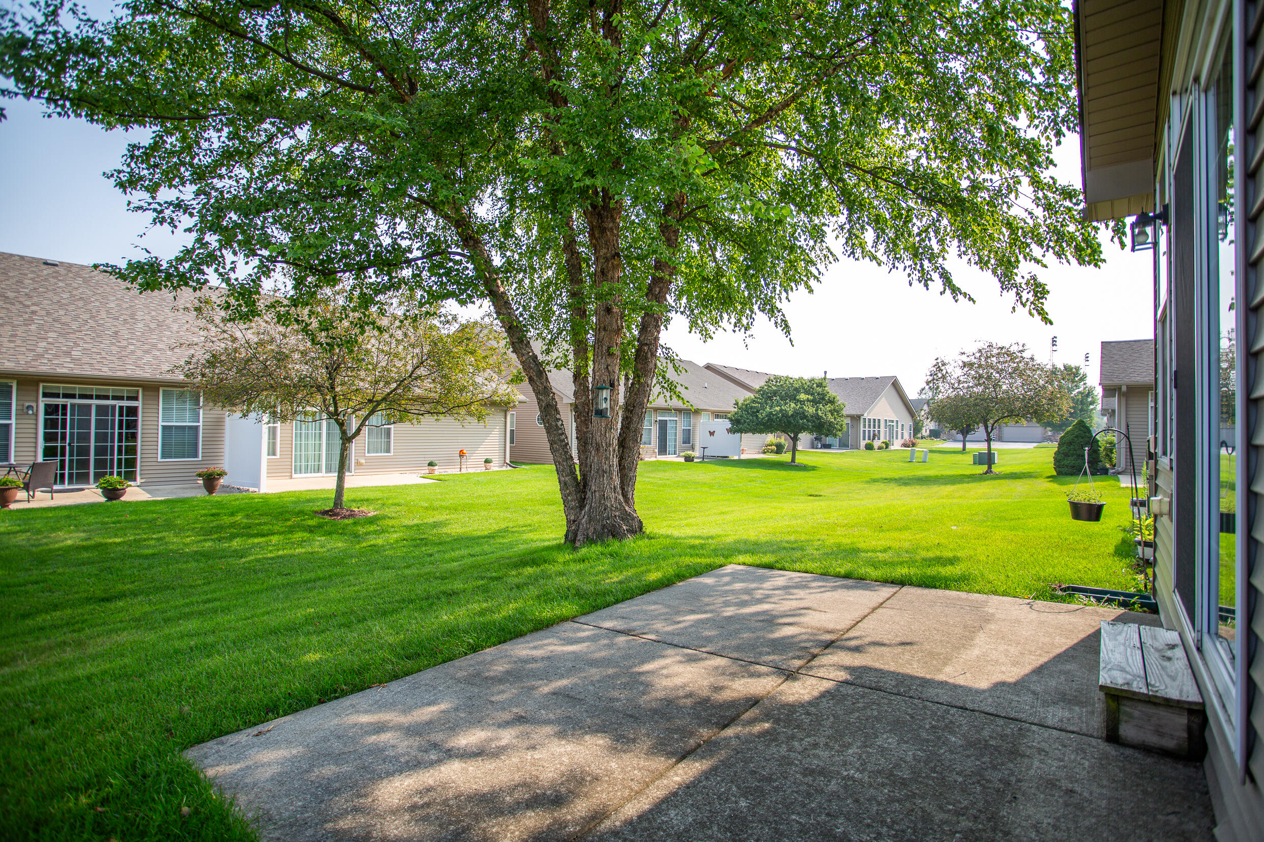 350 Cochran Drive Crown Point, IN 46307 - Photo 4 of 37 a view of a house with a big yard and large trees