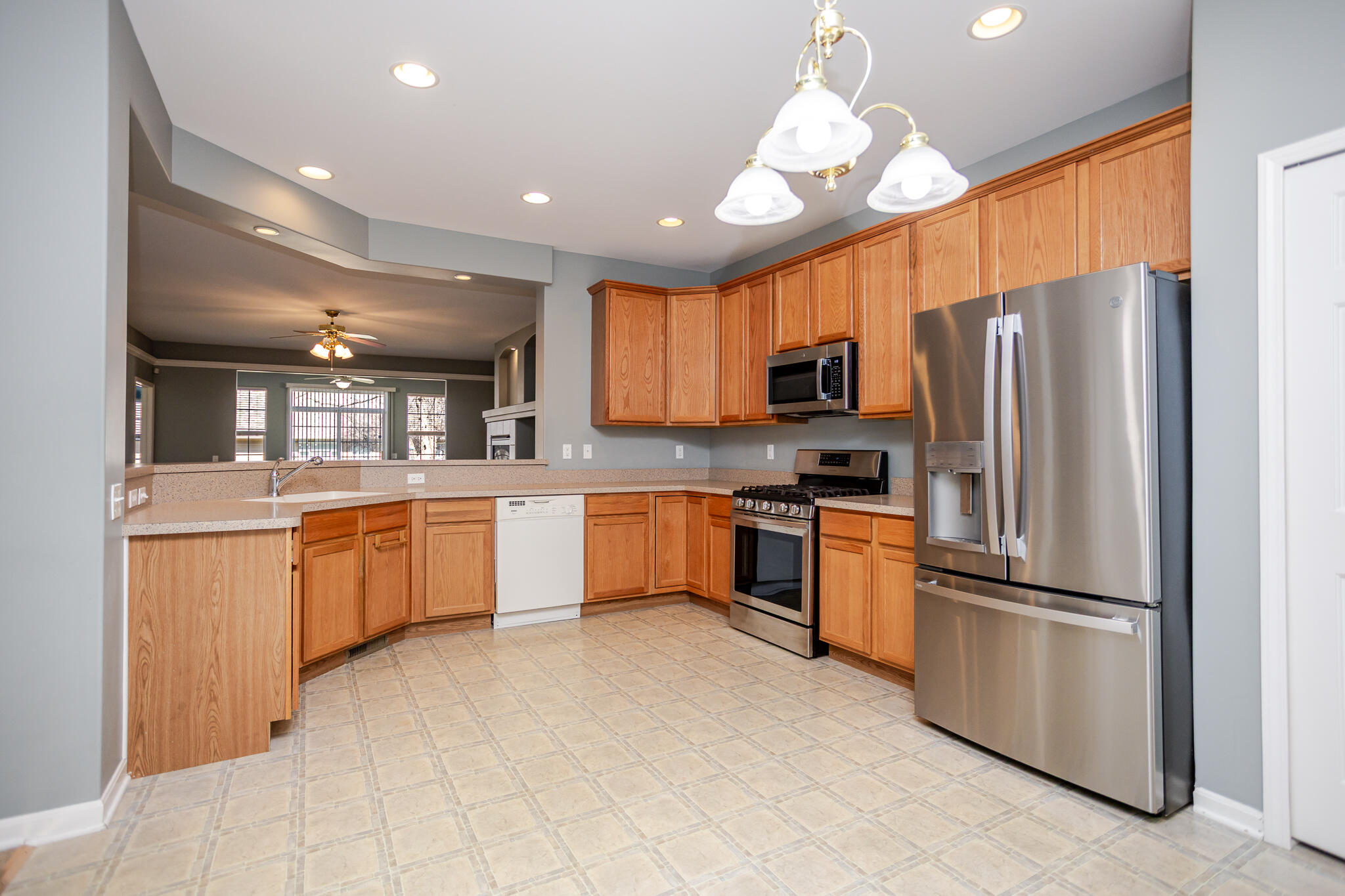 350 Cochran Drive Crown Point, IN 46307 - Photo 5 of 37 a kitchen with a refrigerator sink and microwave