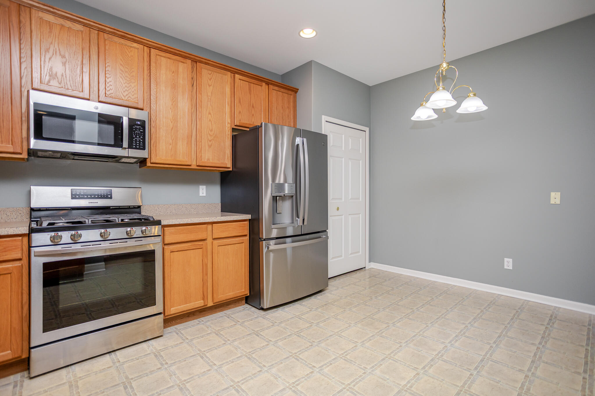 350 Cochran Drive Crown Point, IN 46307 - Photo 9 of 37 a kitchen with stainless steel appliances granite countertop a refrigerator a stove a sink and dishwasher