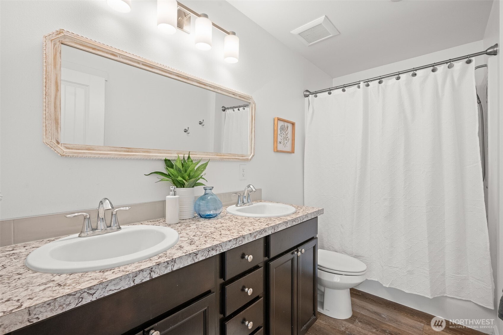 401 East Sunset Ridge Road Union, WA 98592 - Photo 17 of 37 a bathroom with a granite countertop sink and a mirror