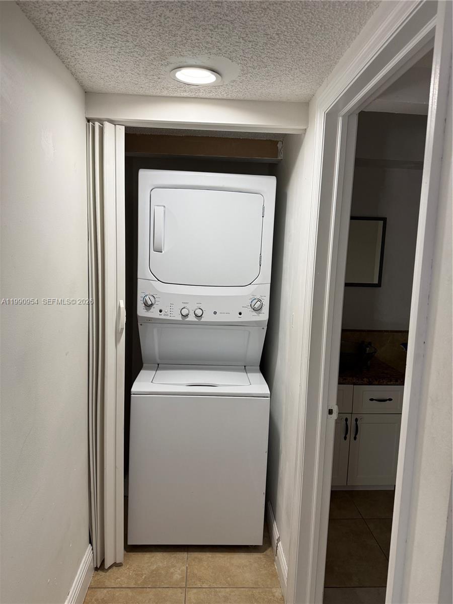 4825 Southwest 149th Court, Unit 18B Miami, FL 33185 - Photo 15 of 36 a utility room with dryer and washer