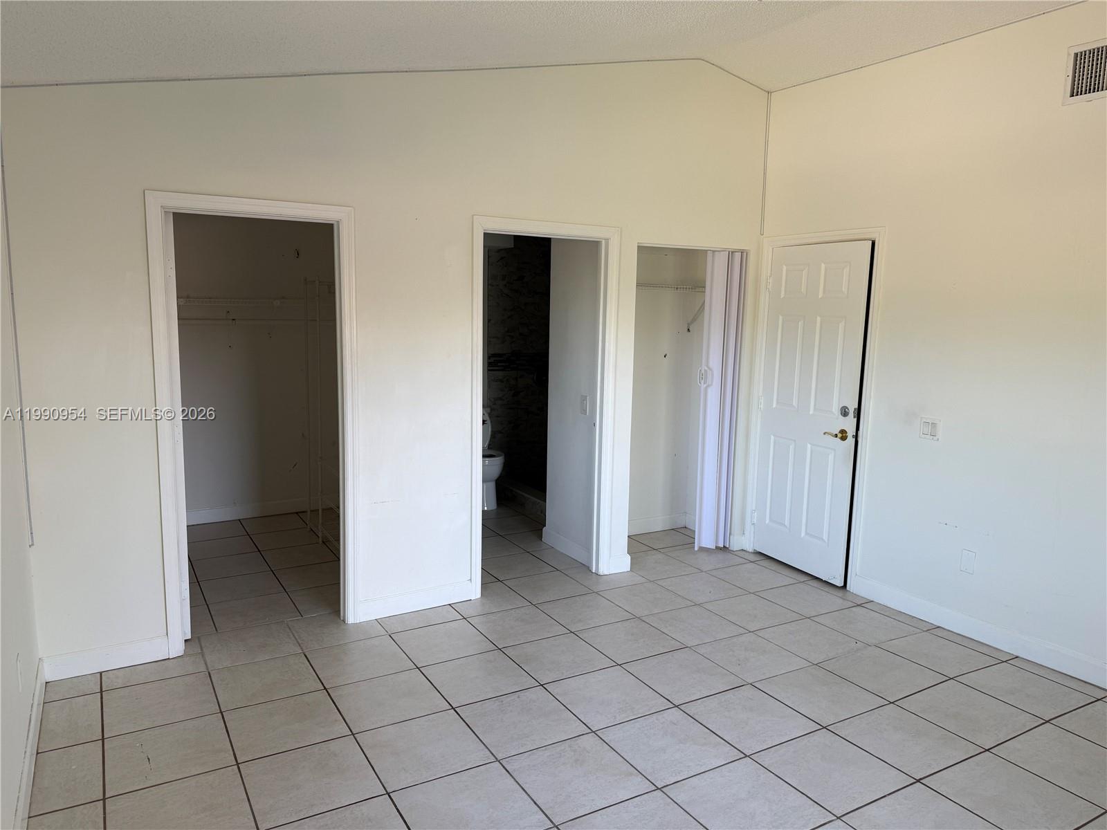 4825 Southwest 149th Court, Unit 18B Miami, FL 33185 - Photo 20 of 36 an empty room with closet