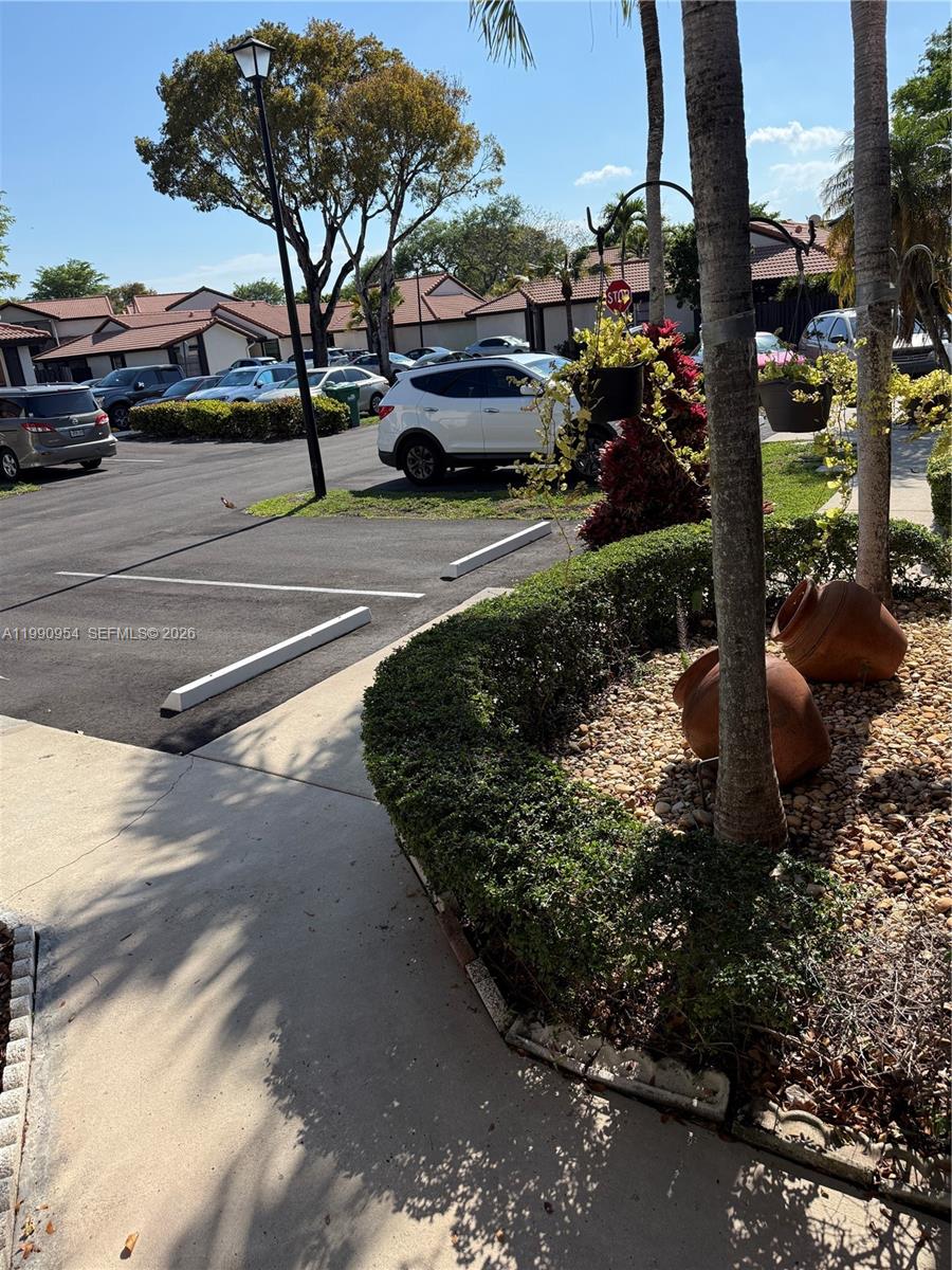 4825 Southwest 149th Court, Unit 18B Miami, FL 33185 - Photo 2 of 36 a view of a street with cars