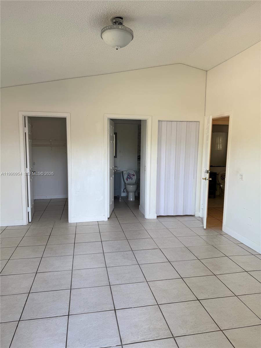 4825 Southwest 149th Court, Unit 18B Miami, FL 33185 - Photo 21 of 36 a view of a livingroom with an empty space and a hallway