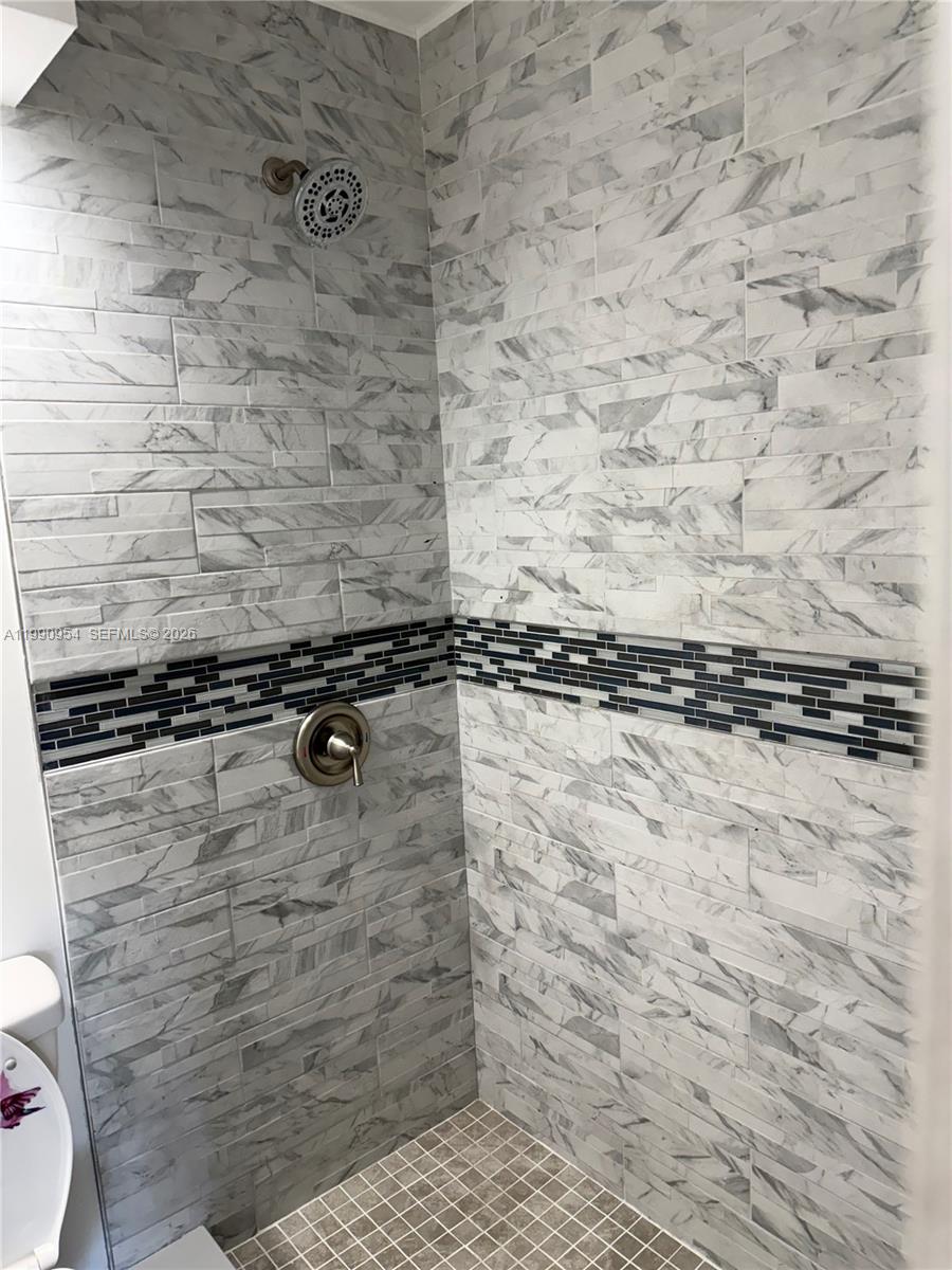 4825 Southwest 149th Court, Unit 18B Miami, FL 33185 - Photo 25 of 36 a bathroom with a shower