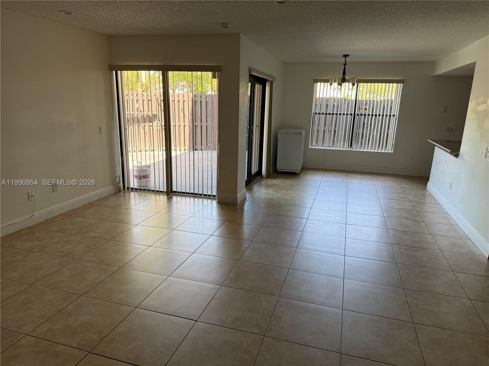 4825 Southwest 149th Court, Unit 18B Miami, FL 33185 - Photo 3 of 36 a view of an empty room with a window