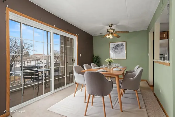 a dining room with furniture and window