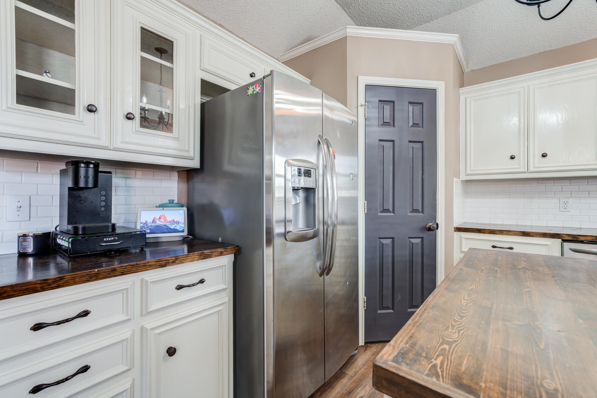 2807 87th Street Lubbock, TX 79423 - Photo 16 of 38 a kitchen with stainless steel appliances granite countertop a refrigerator and a stove