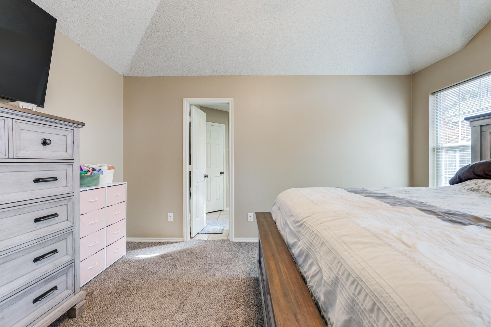 2807 87th Street Lubbock, TX 79423 - Photo 21 of 38 a bedroom with a bed and tv