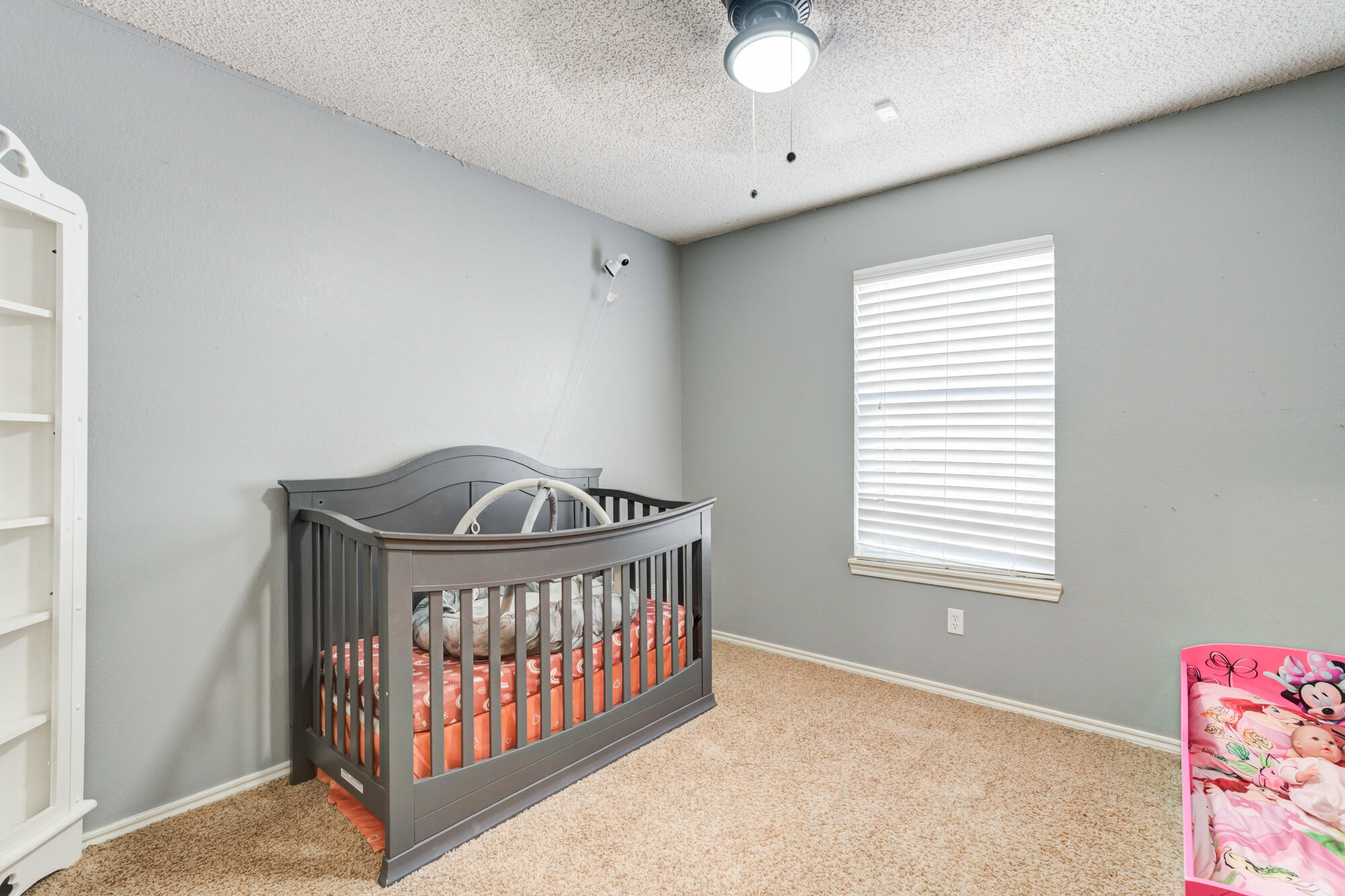 2807 87th Street Lubbock, TX 79423 - Photo 30 of 38 a bedroom with a bed and a window