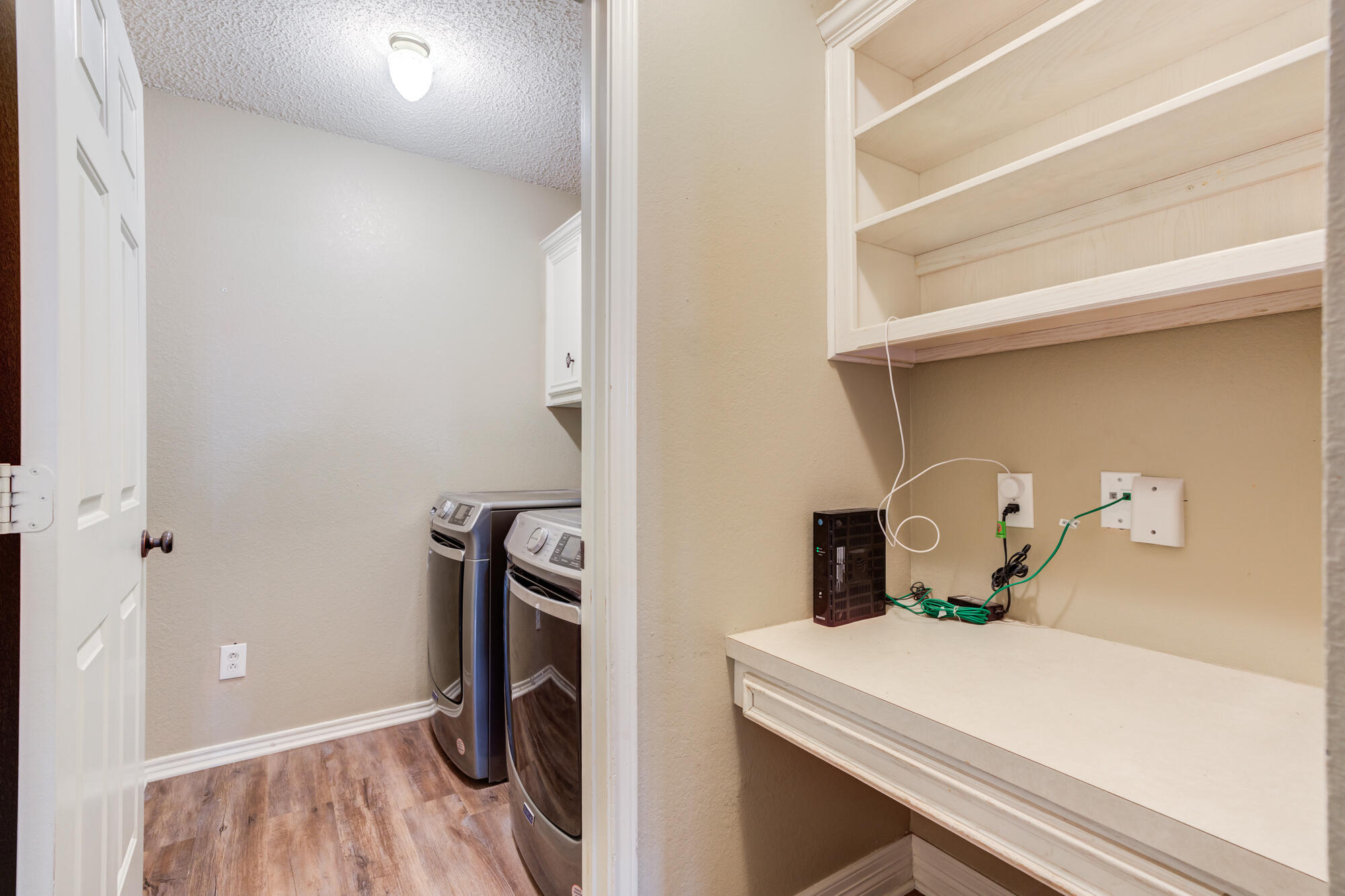 2807 87th Street Lubbock, TX 79423 - Photo 34 of 38 a view of storage and utility room with washer and dryer