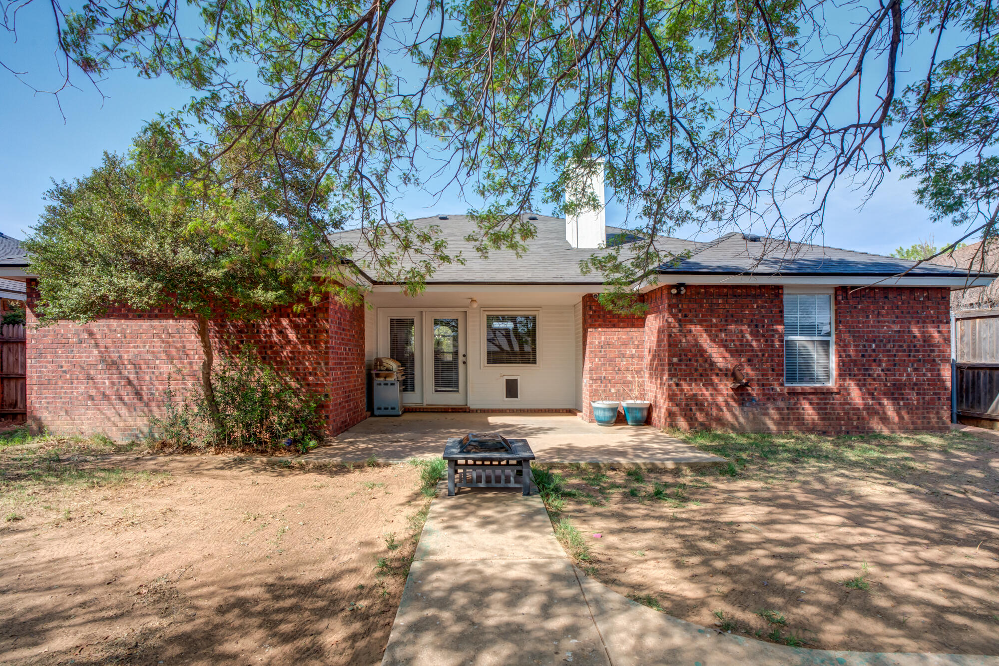 2807 87th Street Lubbock, TX 79423 - Photo 35 of 38 a front view of a house with garden and seating space