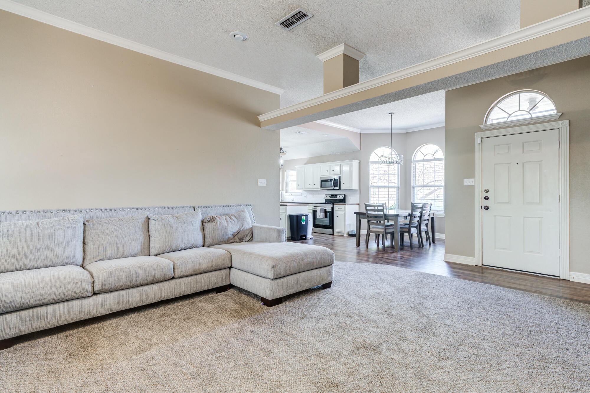 2807 87th Street Lubbock, TX 79423 - Photo 8 of 38 a living room with furniture and a table