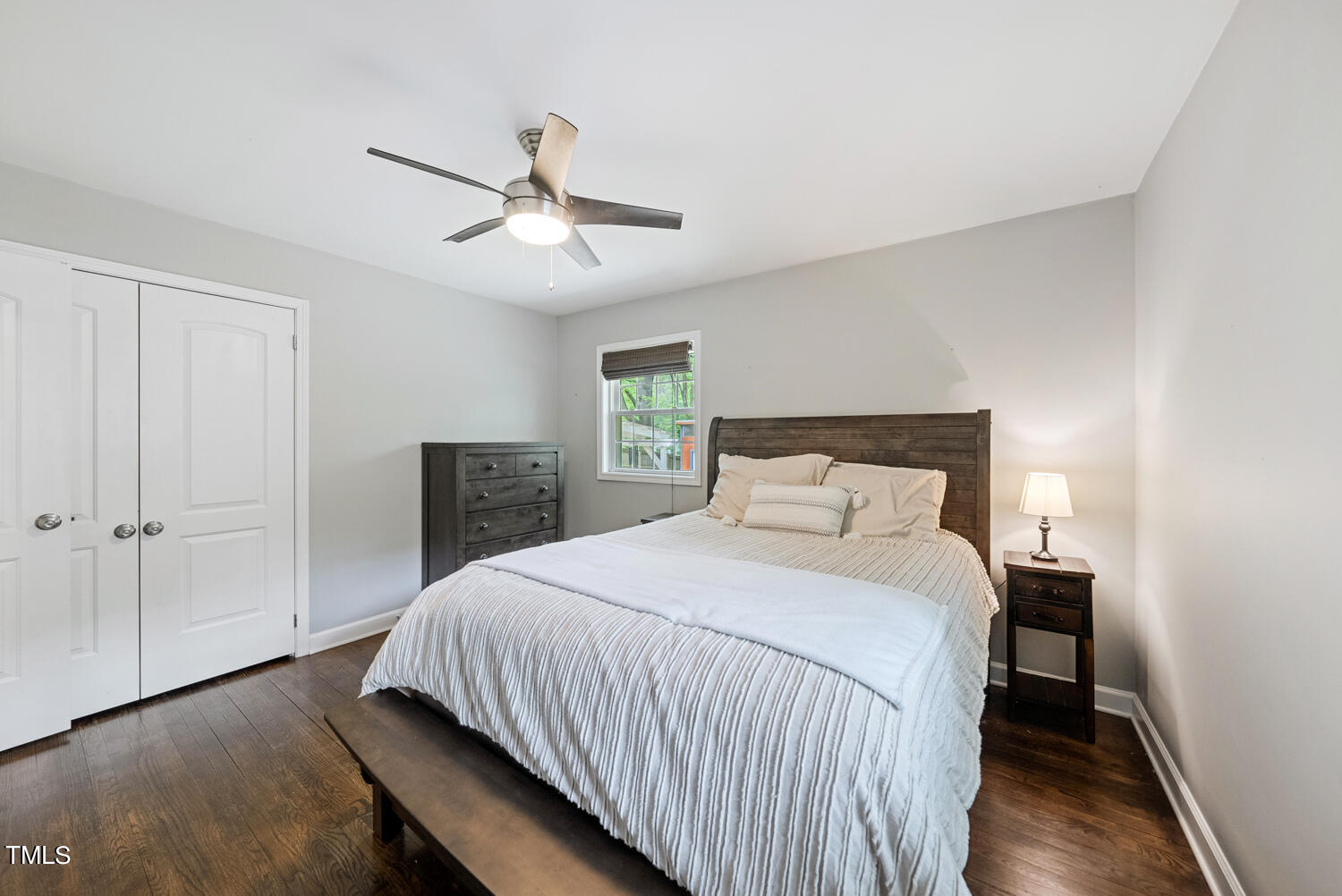 2433 Kennington Road Raleigh, NC 27610 - Photo 18 of 32 a bedroom with a bed and a chandelier