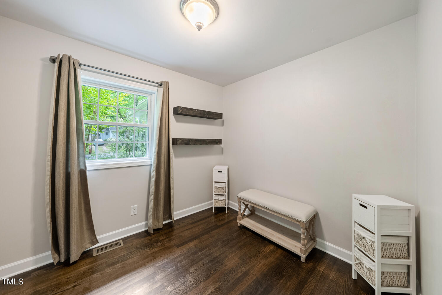 2433 Kennington Road Raleigh, NC 27610 - Photo 20 of 32 a room with a chair and a window
