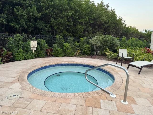 20 Seagate Drive, Unit 703 Naples, FL 34103 - Photo 14 of 19 a view of swimming pool on outdoor space