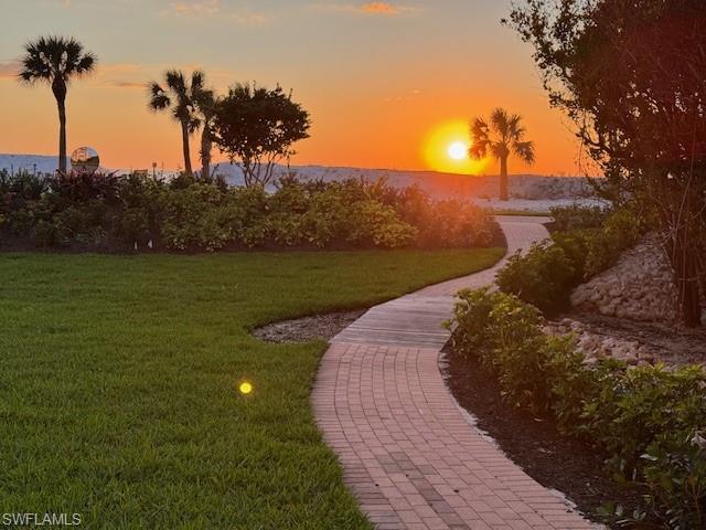 20 Seagate Drive, Unit 703 Naples, FL 34103 - Photo 10 of 19 a view of a lake in middle of the forest